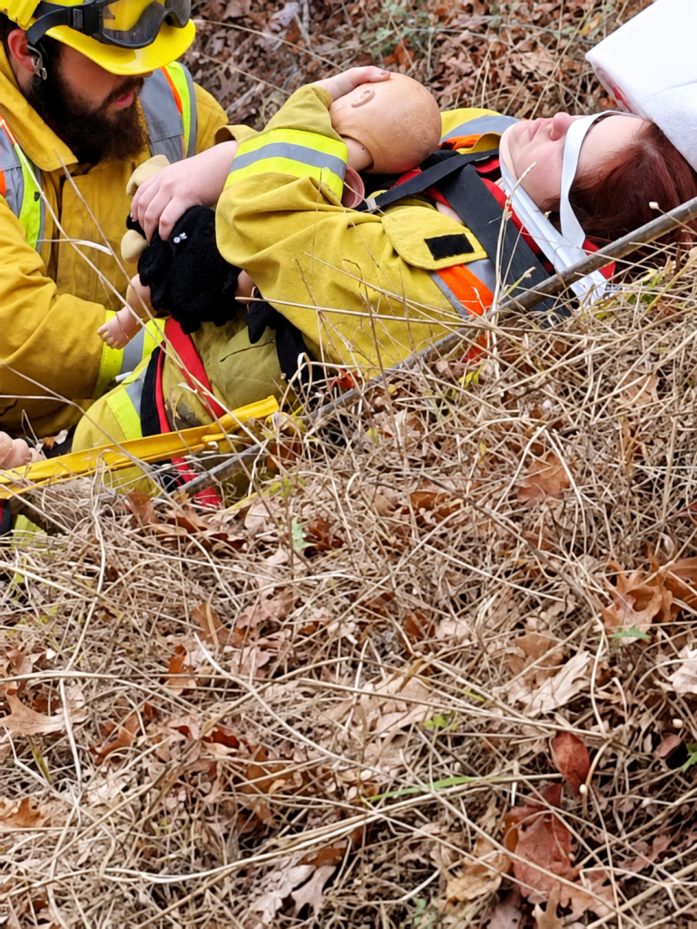 Fire department members practicing emergency response skills during training.